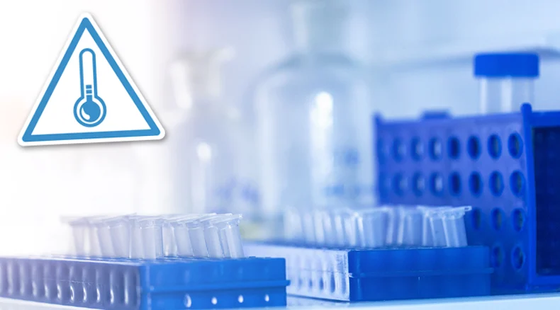 Pharmaceutical vials in the lab with a temperature warning symbol